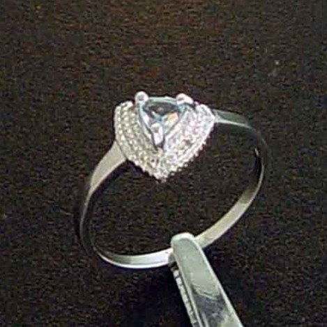 BLUE TOPAZ & DIAMOND STERLING RING: GENUINE BLUE TOPAZ AND DIAMOND STERLING SILVER RING - 5 X 5 X 5 MM FACETED TRILLION CUT BLUE TOPAZ CENTER STONE WITH GENUINE NATURAL DIAMOND ACCENT POINTS - METAL STAMP: .925 - NO TARNISH RHODIUM PLAT