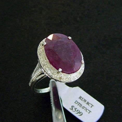 9.8 CT. RUBY & DIAMOND RING - STERLING: LARGE 9.8 CT. GENUINE RUBY AND DIAMOND RING IN STERLING SILVER - FACETED OVAL CUT CENTER RUBY WITH DIAMOND ACCENT GEMS - METAL STAMP: .925 - NO TARNISH RHODIUM PLATINUM FINISH