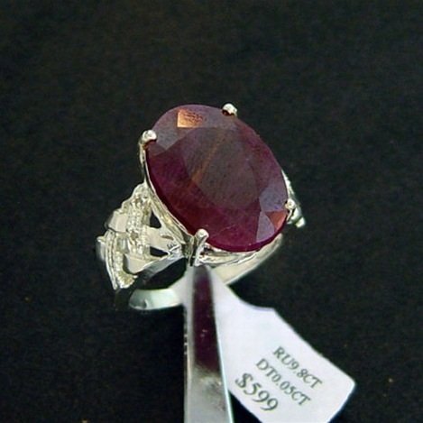 9.8 CT. RUBY & DIAMOND RING - STERLING: LARGE 9.8 CT. GENUINE RUBY AND DIAMOND RING IN STERLING SILVER - FACETED OVAL CUT CENTER RUBY WITH DIAMOND ACCENT GEMS - METAL STAMP: .925 - NO TARNISH RHODIUM PLATINUM FINISH