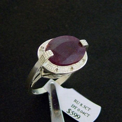 8.5 CT. RUBY & DIAMOND RING - STERLING: LARGE 8.5 CT. GENUINE RUBY AND DIAMOND RING IN STERLING SILVER - FACETED OVAL CUT RUBY WITH DIAMOND ACCENT GEMS - METAL STAMP: .925 - NO TARNISH RHODIUM PLATINUM FINISH