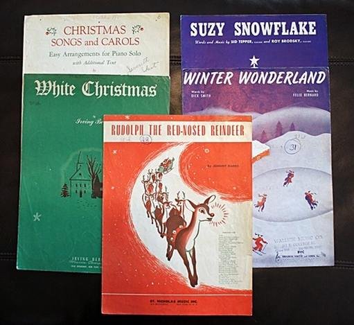 LOT OF CHRISTMAS SHEET MUSIC FROM 1934-1951: LOT OF CHRISTMAS SHEET MUSIC FROM 1934-1951 - LOT INCLUDES "WHITE CHRISTMAS" IRVING BERLIN (1942) (STORE STAMP AND SOME HANDWRITING IN PENCIL ON COVER, FOXING AND WEAR SHOWING AT CORNERS, ALONG EDGES,