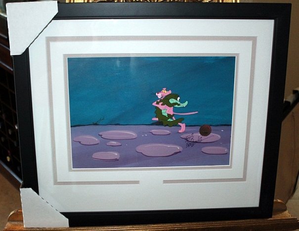 FRIZ FREELING HAND PAINTED / SIGNED ANIMA. CELL: ISADORE "FRIZ" FRELENG (1906-1995) HAND PAINTED AND HAND SIGNED ANIMATION CELL ALSO WITH HAND PAINTED BACKGROUND - "PINK PANTHER WITH ALIGATOR" - PROFESSIONALLY FRAMED AND MATTED - AUTHENTICATION WITH
