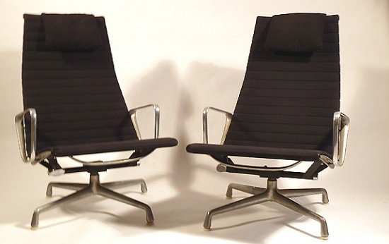CHARLES AND RAY EAMES ALUMINUM GROUP LOUNGE CHAIRS: 1958 Charles and Ray Eames Aluminum Group Chairs. In original black fabric. Both with head rests, Herman Miller embosed logo and the Herman Miller 1 label. H 38", W 24&quo