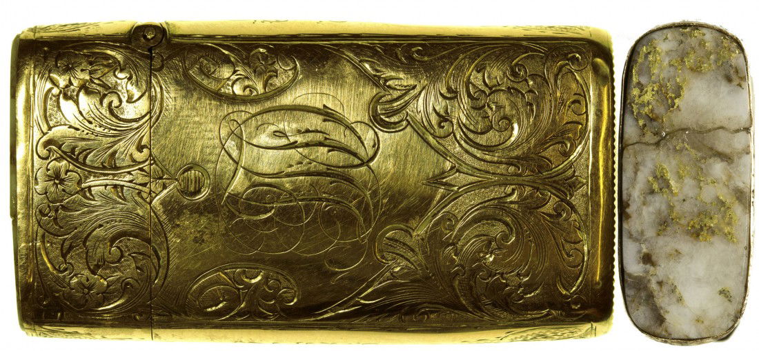 Gold Quartz Match Safe: c1860's - 58mm long x 31mm wide x 12mm depth. Obverse shows a stag, reverse caligraphy initials "J.D.L" Gold quarts top with cracked fissure. Good overall condition with honest pocket wear.