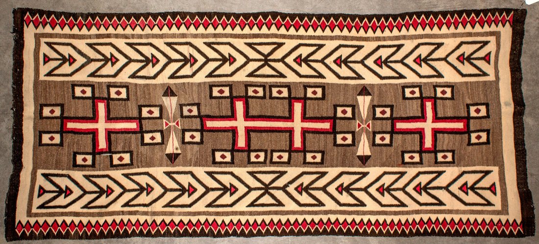 Navajo Rug -: c1900 A long and finely woven wool piece measuring 39â€ x 87â€ in length in traditional colors of natural, gray, dark brown/black and red. The design consists of banded short ends, and edged on 