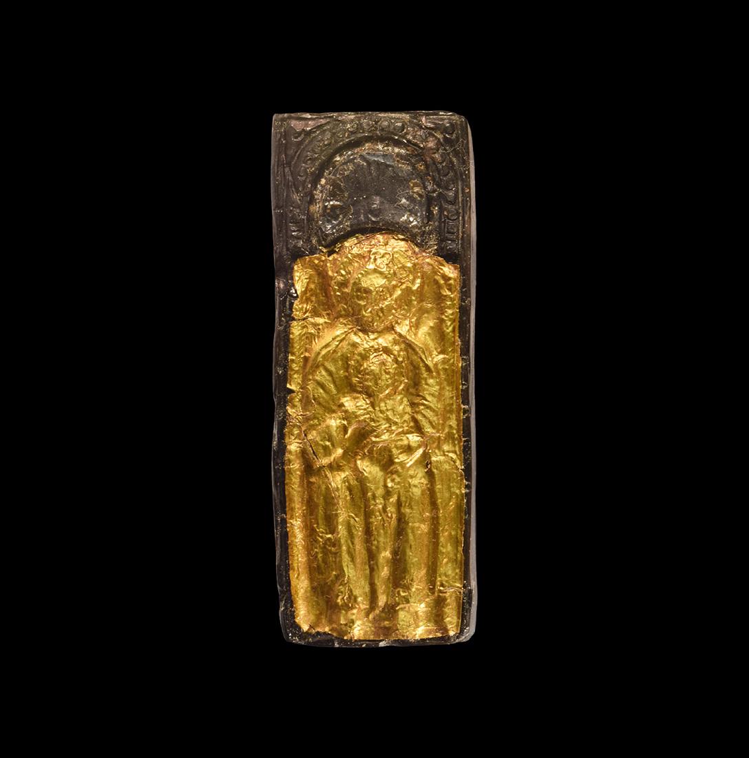 Post Medieval Tudor Gold Foiled Bone Plaque: 16th-17th century AD. A carved bone plaque of the seated Virgin Mary covered in gold foil, holding the Christ child in her lap, with arch above. 22 grams, 79 mm (3"). Property of a UK gentleman; forme
