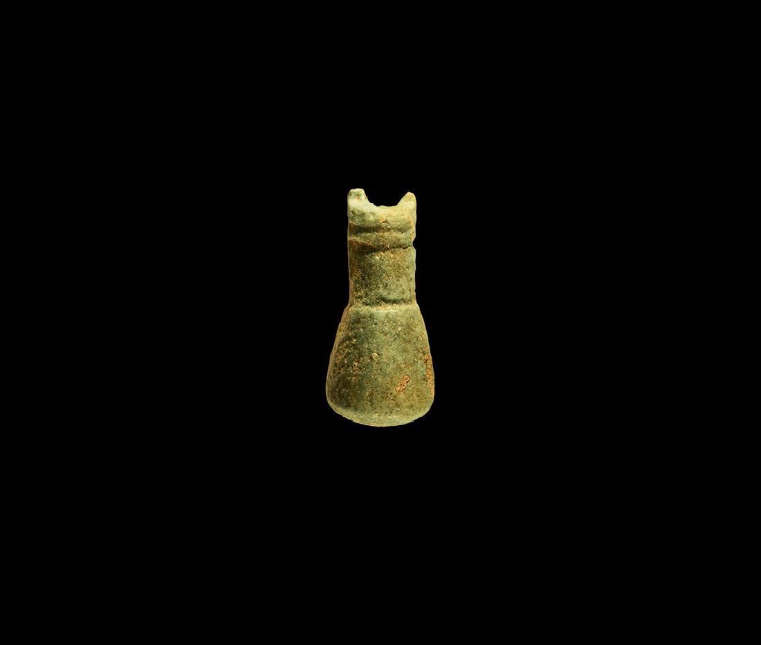 Egyptian Miniature Vessel Amulet: Third Intermediate Period, 1069-702 BC. A green and blue glazed composition miniature jar with rounded bottom and flared rim, attachment holes for handle. See Andrews, C. Amulets of Ancient Egypt, Lon