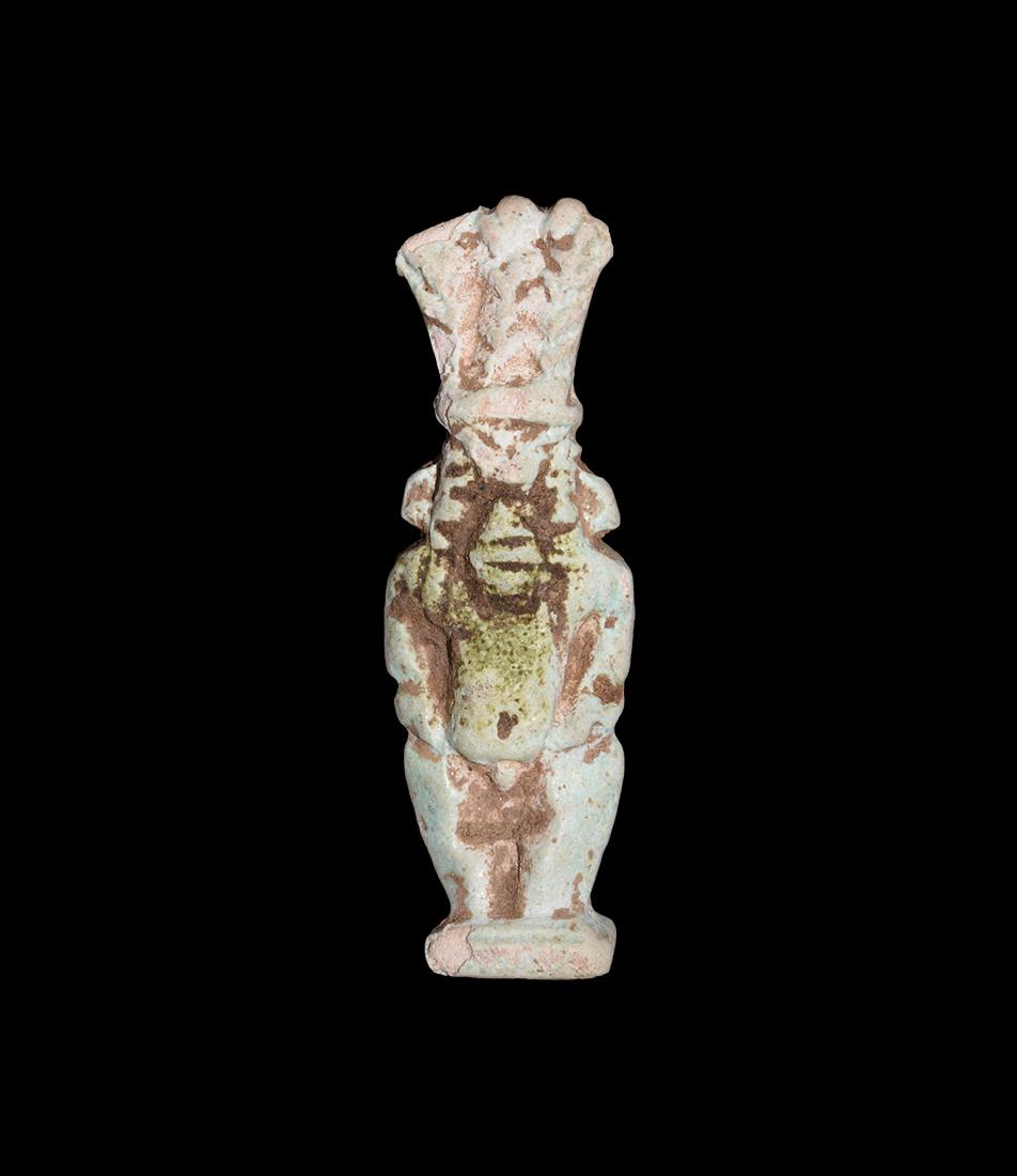 Egyptian Bifacial Bes Amulet: Third Intermediate Period, 1069-702 BC. A pale blue bifacial figure of Bes standing on a square base, wearing the feather headdress. Cf. Andrews, C. Amulets of Ancient Egypt, London, 1994, item 37 (d)