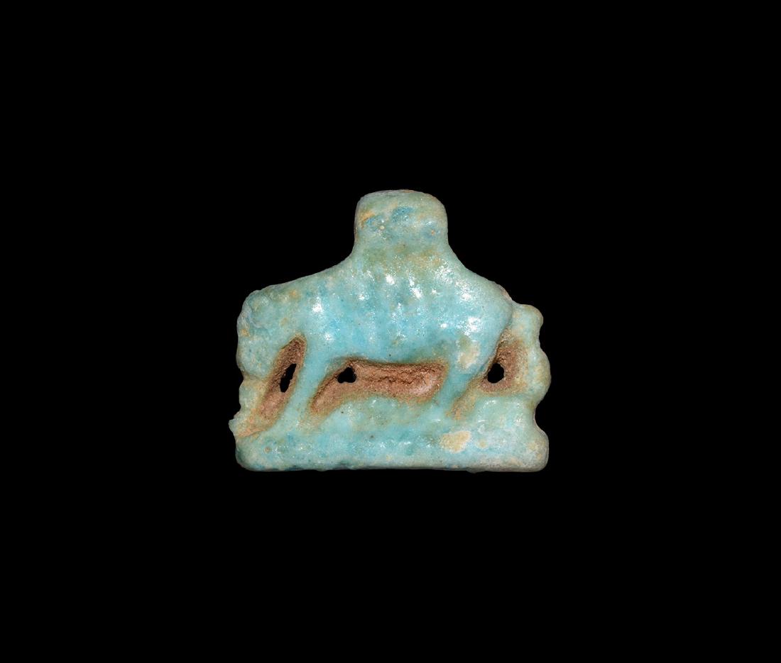 Egyptian Sow Amulet: Third Intermediate Period, 1069-702 BC. A blue glazed composition amuletic figure of the sky-goddess Nut in the form of a sow walking with her young beneath her stomach on a long base. Cf. Andrews, C.