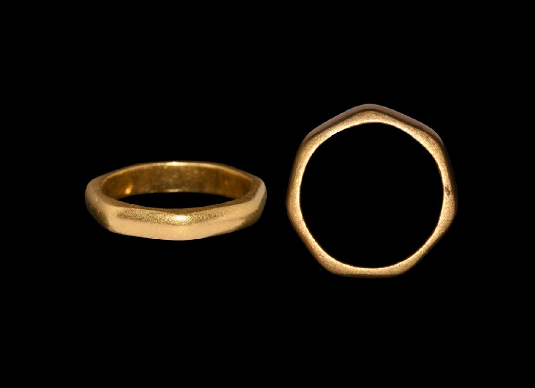 Roman Gold Heptagon Military Ring: 1st-3rd century AD. A gold finger ring D-shaped in section with flat lateral faces, seven facets. Cf. Chadour, A.B. Rings. The Alice and Louis Koch Collection, volume I, Leeds, 1994, item 388. 4.86 gr