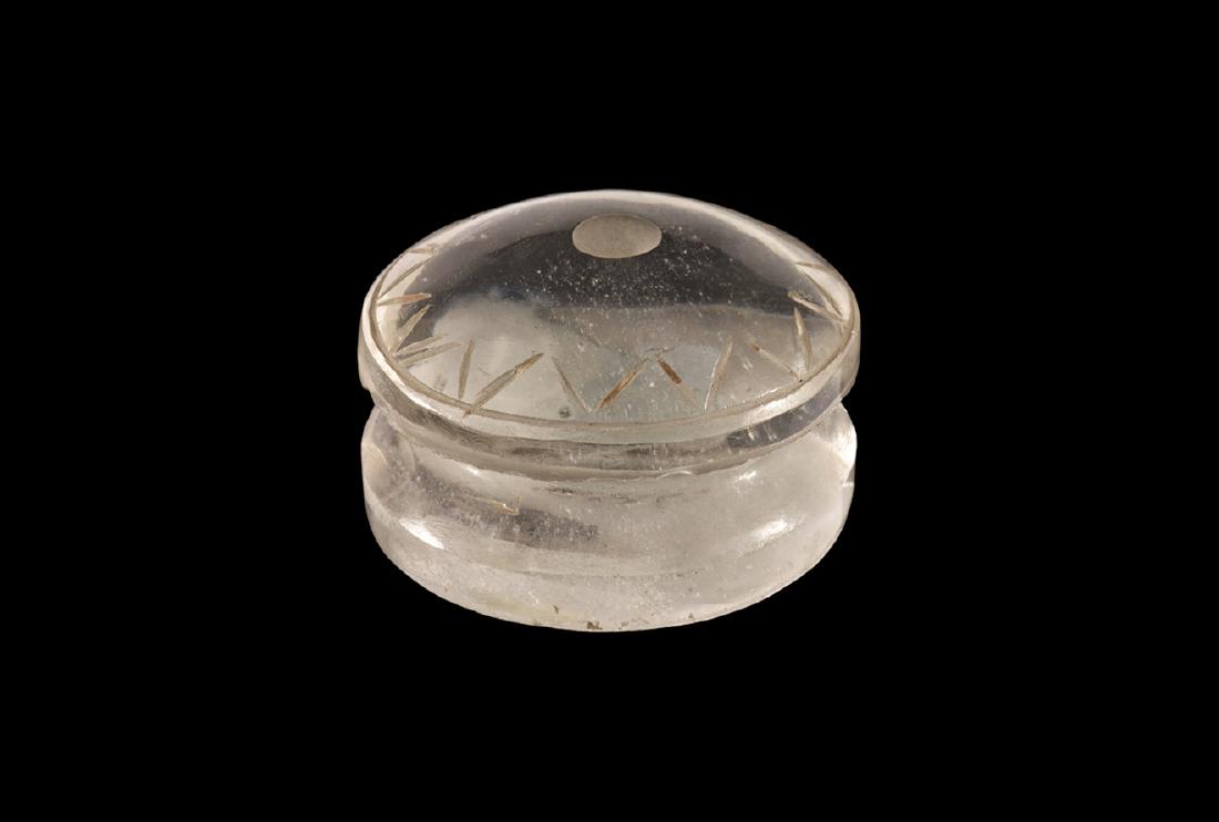 Byzantine Rock Crystal Weight: 8th-10th century AD. A carved rock crystal weight with gussetted sides, domed upper face with central socket and incised running zigzag; old collector's label '87.269' to the underside. 25 grams, 29mm