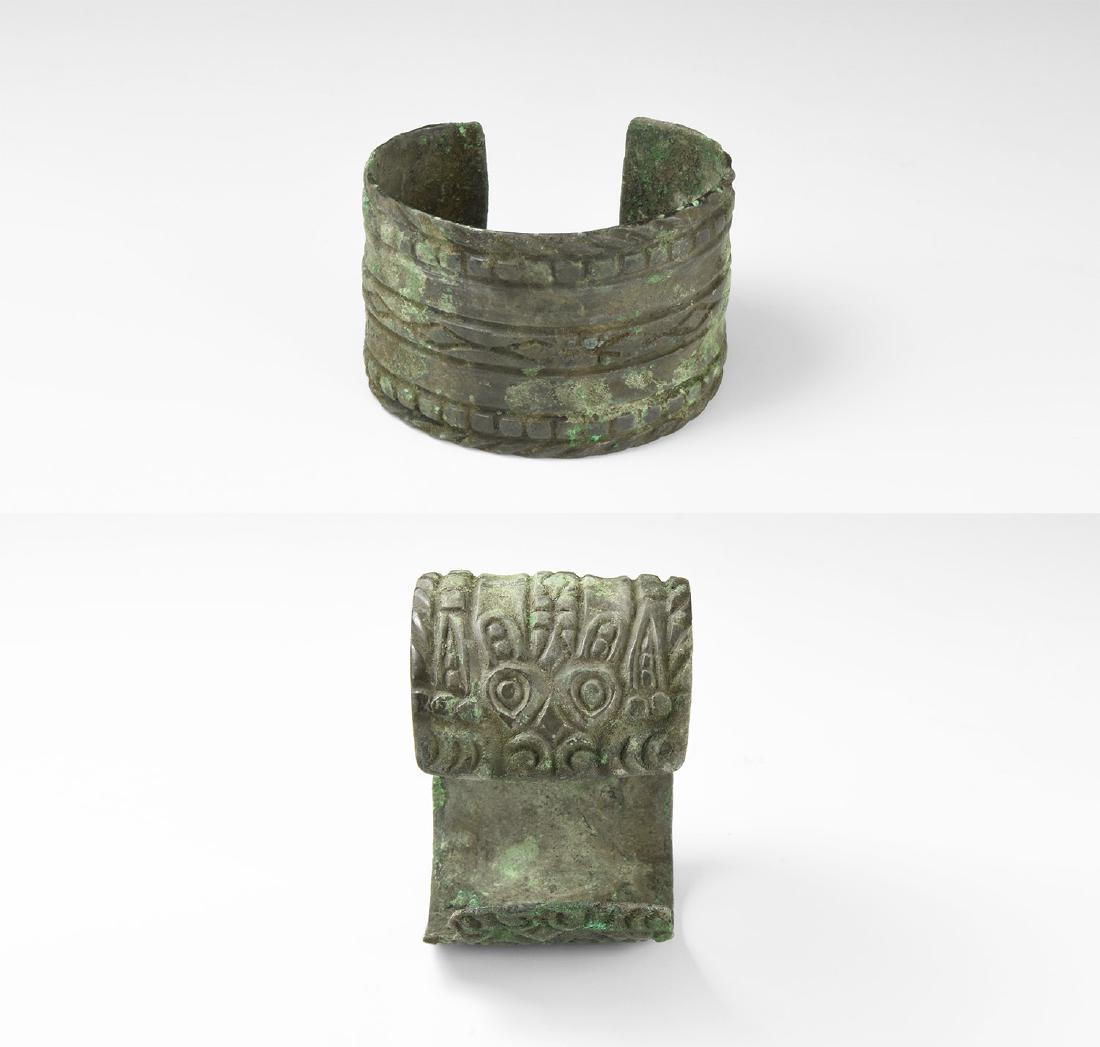 Viking 'Bear-Skin' Bracelet: 9th-11th century AD. A bronze flat-section penannular bracelet with a bear's head in plan to each terminal, geometric ornament. Cf. Sedov, B.B. Finno-Ugri i Balti v Epokhi Srednevekovija, Moscow, 1987