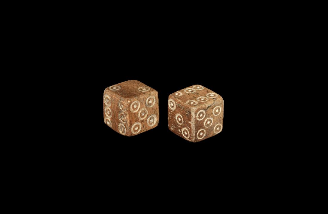 Roman Large Bone Dice Pair: 1st-4th century AD. A pair of bone cuboid dice with engraved circles to each face for numbers: 6:1,5:4,3:2, and 6:1,5:4,3:2. 6.28 grams total, 12mm (1/2"). From a Home Counties collection; formed 1970