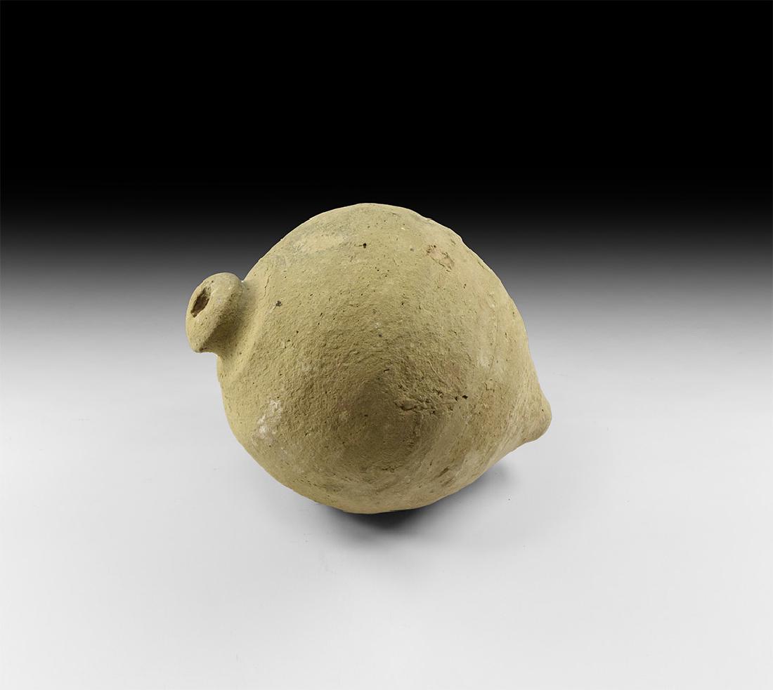 Byzantine 'Greek Fire' Hand Grenade: 10th-12th century AD. A ceramic biconvex vessel with thick nozzle, raised shoulder. Cf. Arendt, W.Irene Granaten des 13-14. Jahrhunderts, die an der Wolga gefunden sind, Zeitschrift fur Historische Wa