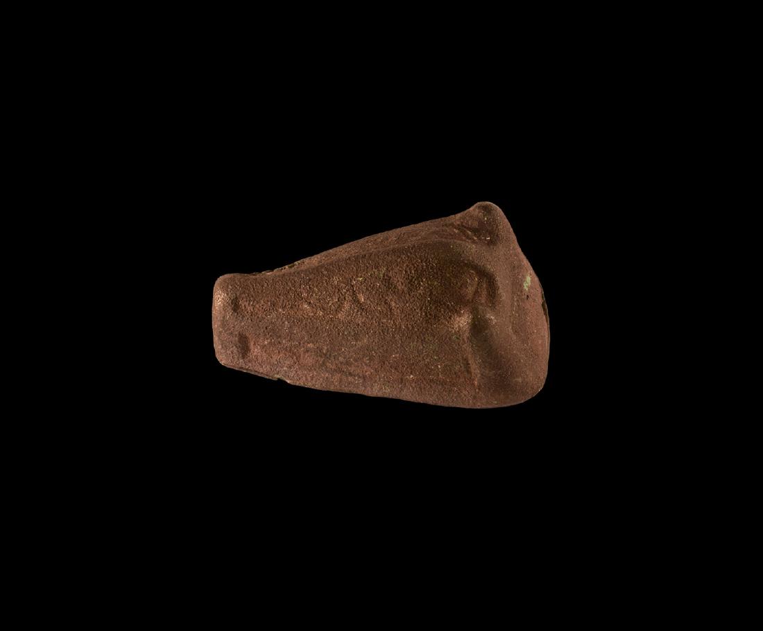 Boar-Head Brooch: 9th-10th century AD. A Scandinavian boar-head brooch, cast in two sections with a decorative upper element attached to a plain back-plate with spring-lugs and catchplate intact; hollow upper section d