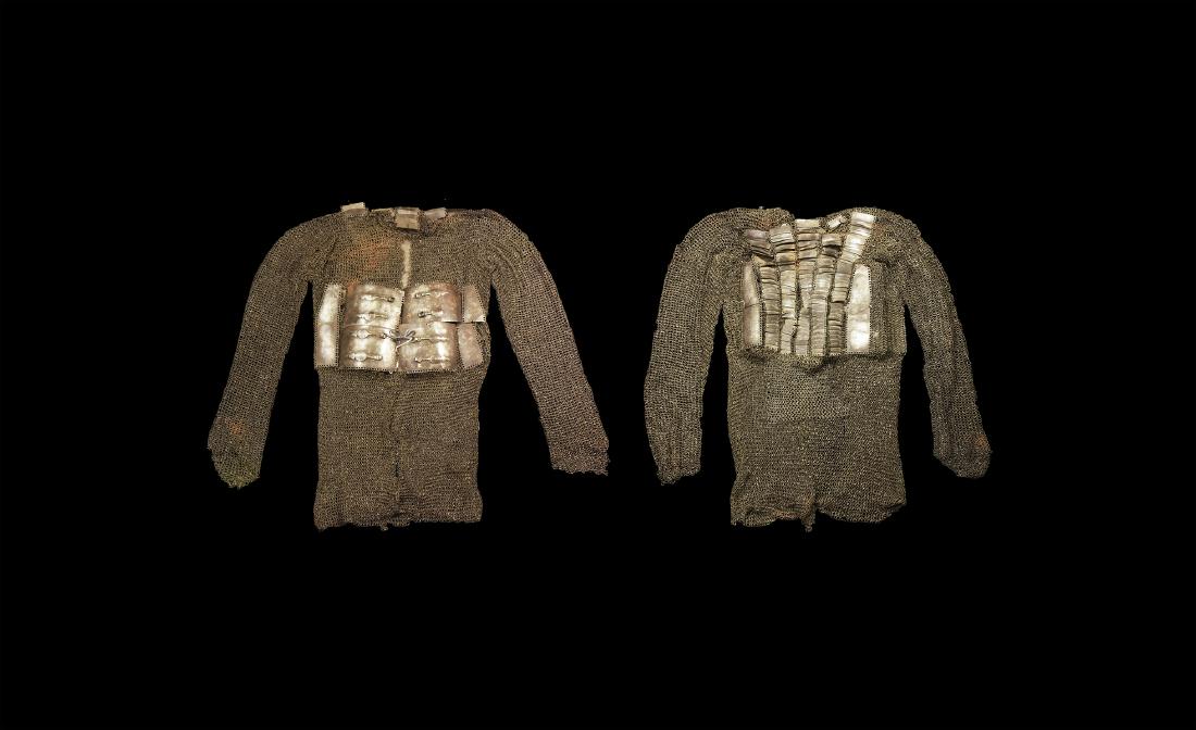 Indian Deccan Suit of Armour: Mid 17th century AD. A ferrous mailshirt of alternating riveted and butted rings with applied rectangular dished panels to the shoulders and chest, integral sleeves. 7.1 kg, 1m (39 1/4"). Property of
