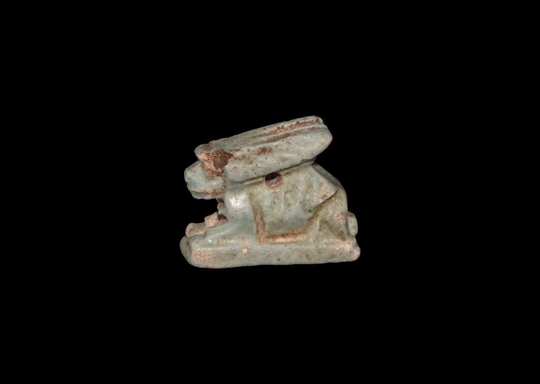 Egyptian Hare Amulet: Late Dynastic Period, 664-332 BC. A pale green glazed composition amuletic figure of a hare on a rectangular base with rib detailing to the flanks and ears. See Andrews, C. Amulets of Ancient Egypt, L
