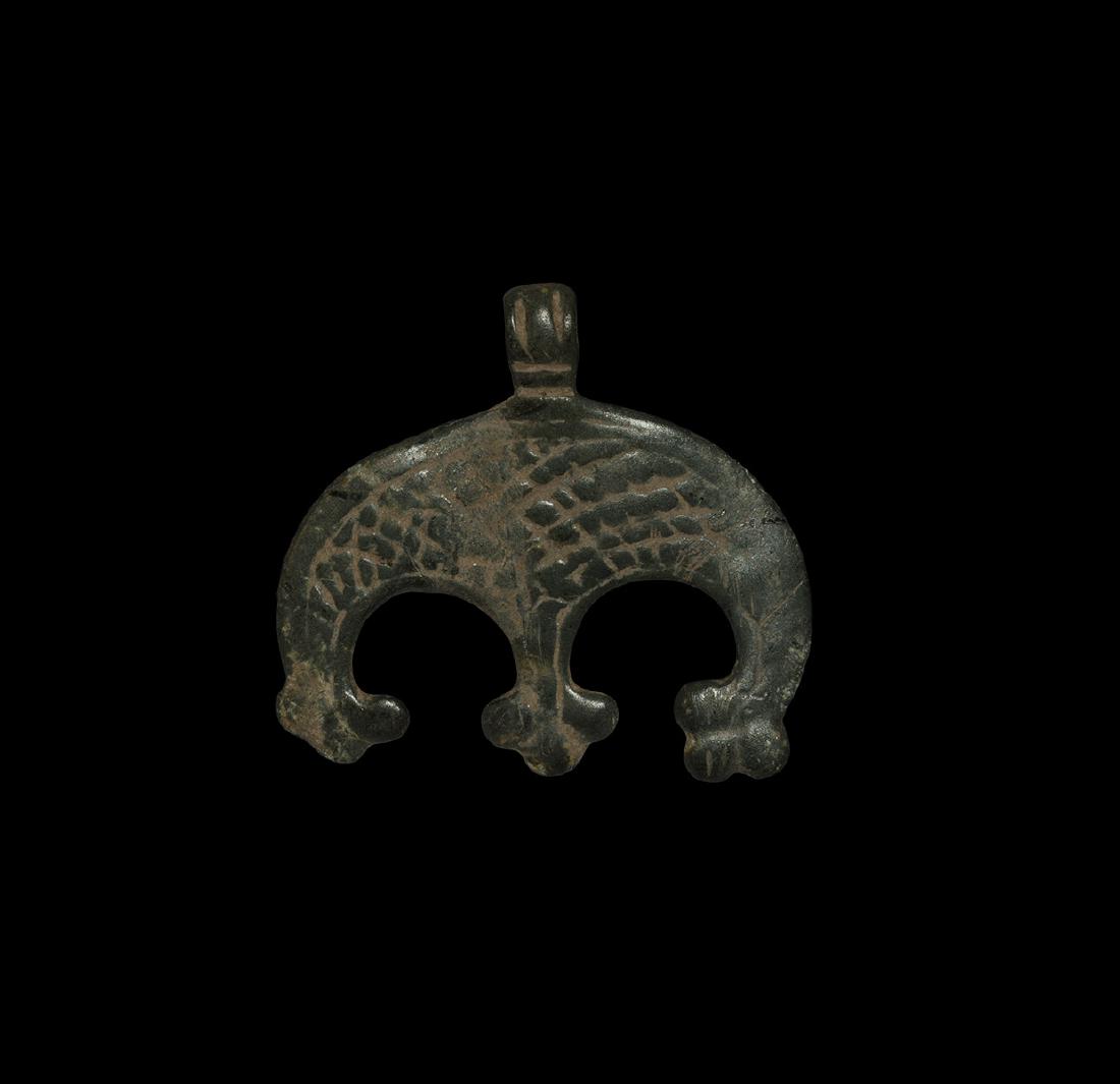 Viking Lobed Pendant: 9th-12th century AD. A bronze pendant comprising a hatched crescent plaque and three trilobe elements below, ribbed loop. See Sedov, B.B. Finno-Ugri i Balti v Epokhi Srednevekovija, Moscow, 1987, plat