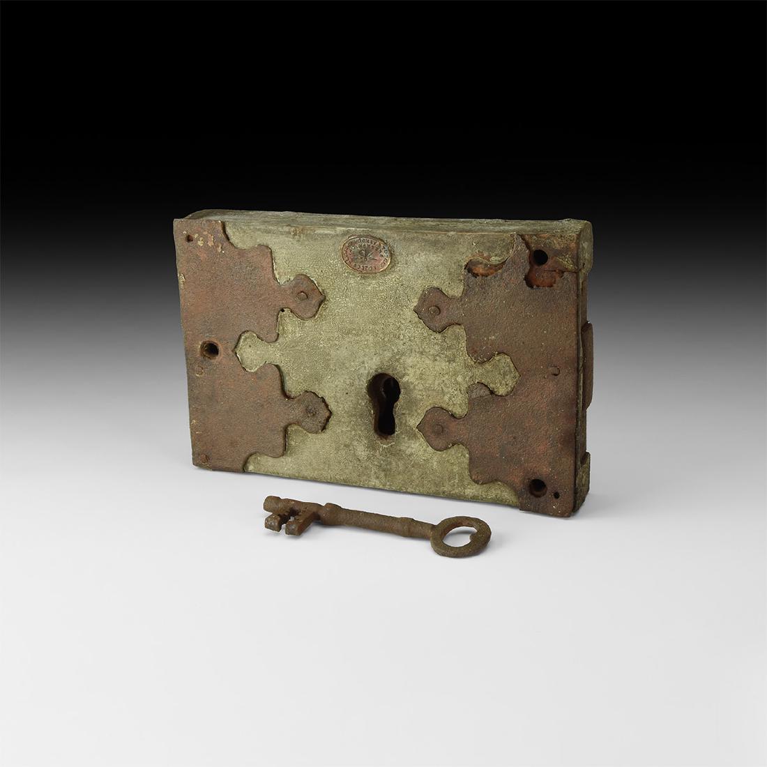 Victorian Wood Cased Mortice Lock and Key: 19th century AD. An iron mortice door lock in original wood casing with original paint finish together with applied iron decorative plates and embossed brass maker's plate inscribed 'HAYWARD HOOKEY & 