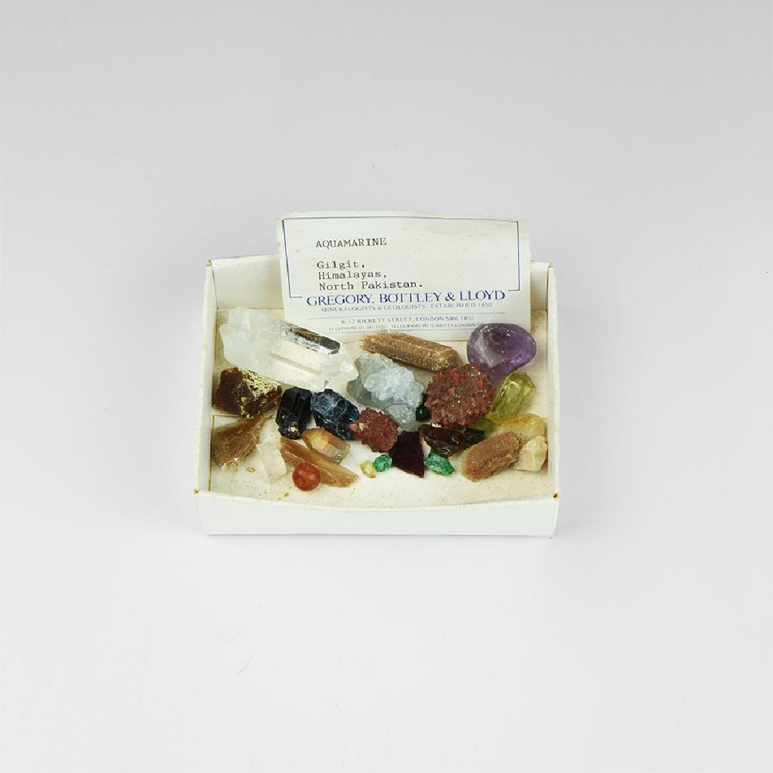 Natural History - Mineral Specimen Collection: A mixed group of mineral specimens in a white card collector's tray, including amethyst, rock crystal, carnelian, agate and others. 90 grams including box, 5-45mm (1/4 - 1 3/4"). From the historic ‘