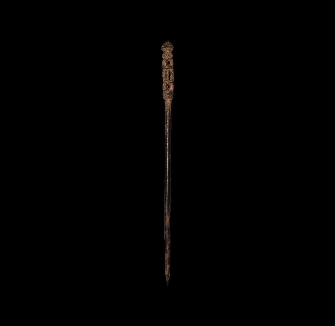 Byzantine Large Pin with Elaborate Head: 10th-12th century AD. A bronze dress pin with tapering shank, square-section hollow-formed baluster with lateral voids, biconvex finial. See Wamser, L. & Zahlhaas, G. Rom und Byzanz. Archäologische K