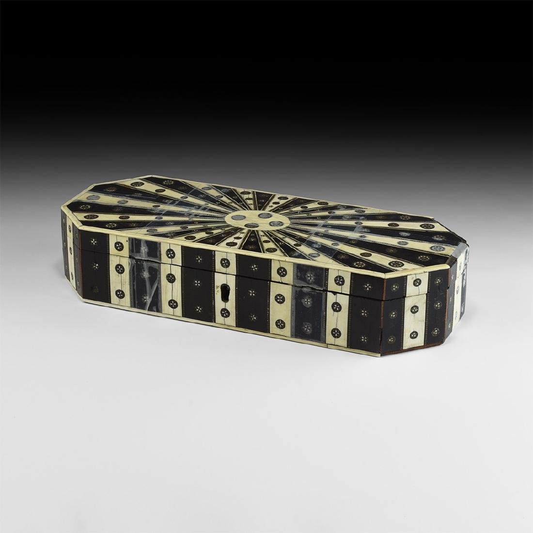 Anglo-Indian Inlaid Glove Box: Late 19th-early 20th century AD. A wooden glove box with hinged lid and velvet lining; the outer faces covered with marquetry panels in bone and ebony, geometric design of radiating bands with disc in