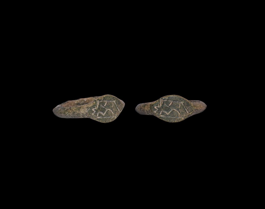 Merovingian Ring with Inscription: 6th century AD. A ring with bronze D-section hoop, scaphoid bezel with incised monogram including 'BA'. See Hadjadj, R. Bagues Merovingiennes - Gaul du Nord, Paris, 2007. 6.11 grams, 27mm overall (1")