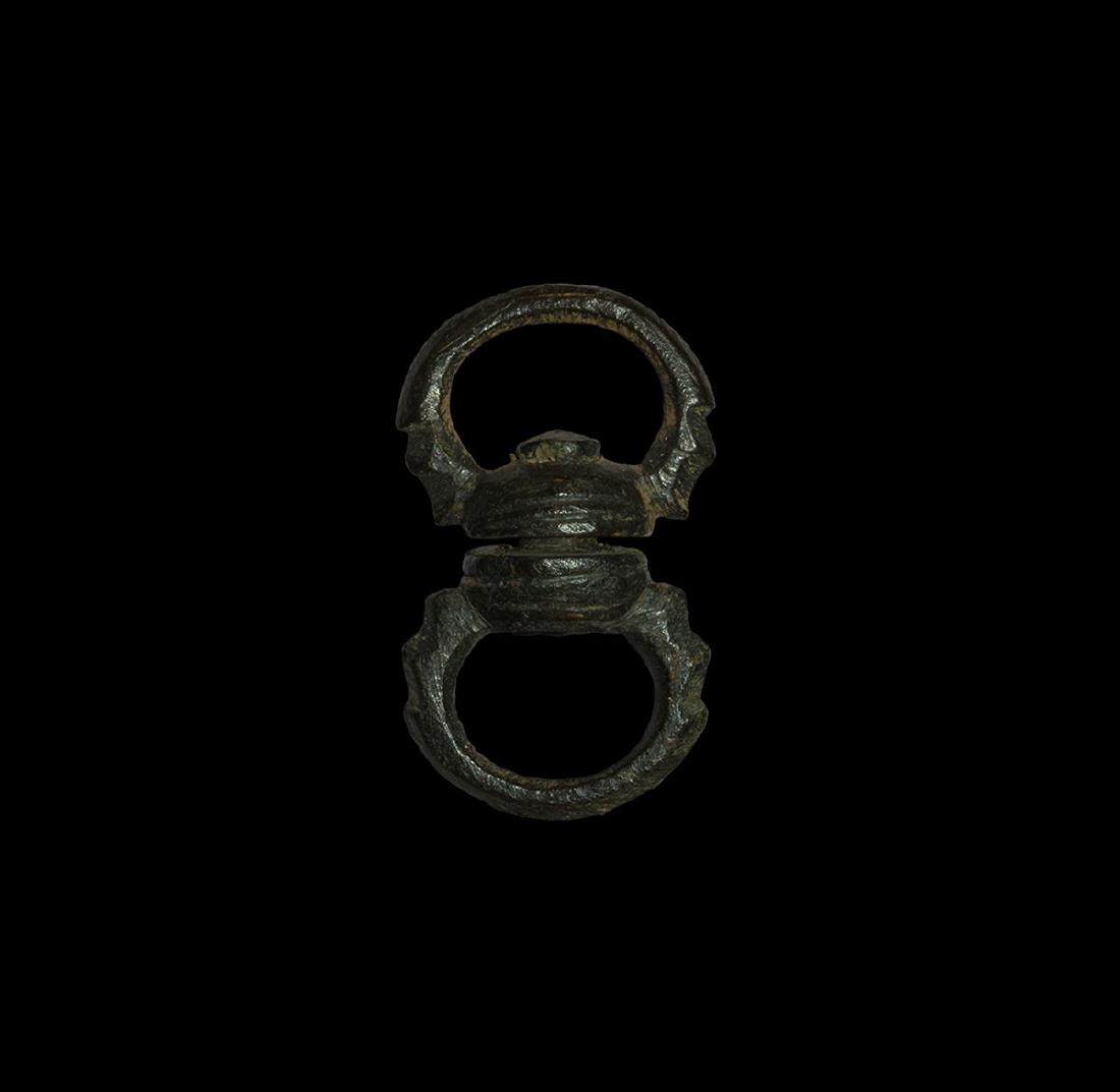 Anglo-Norman Hunting Dog Leash Swivel: 11th-12th century AD. A swivel-mount with rings, each loop formed as a pair of opposed zoomorphic heads clutching the swivel-half in its jaws. Hammond, B. British Artefacts Volume 3 - Late Saxon, Late