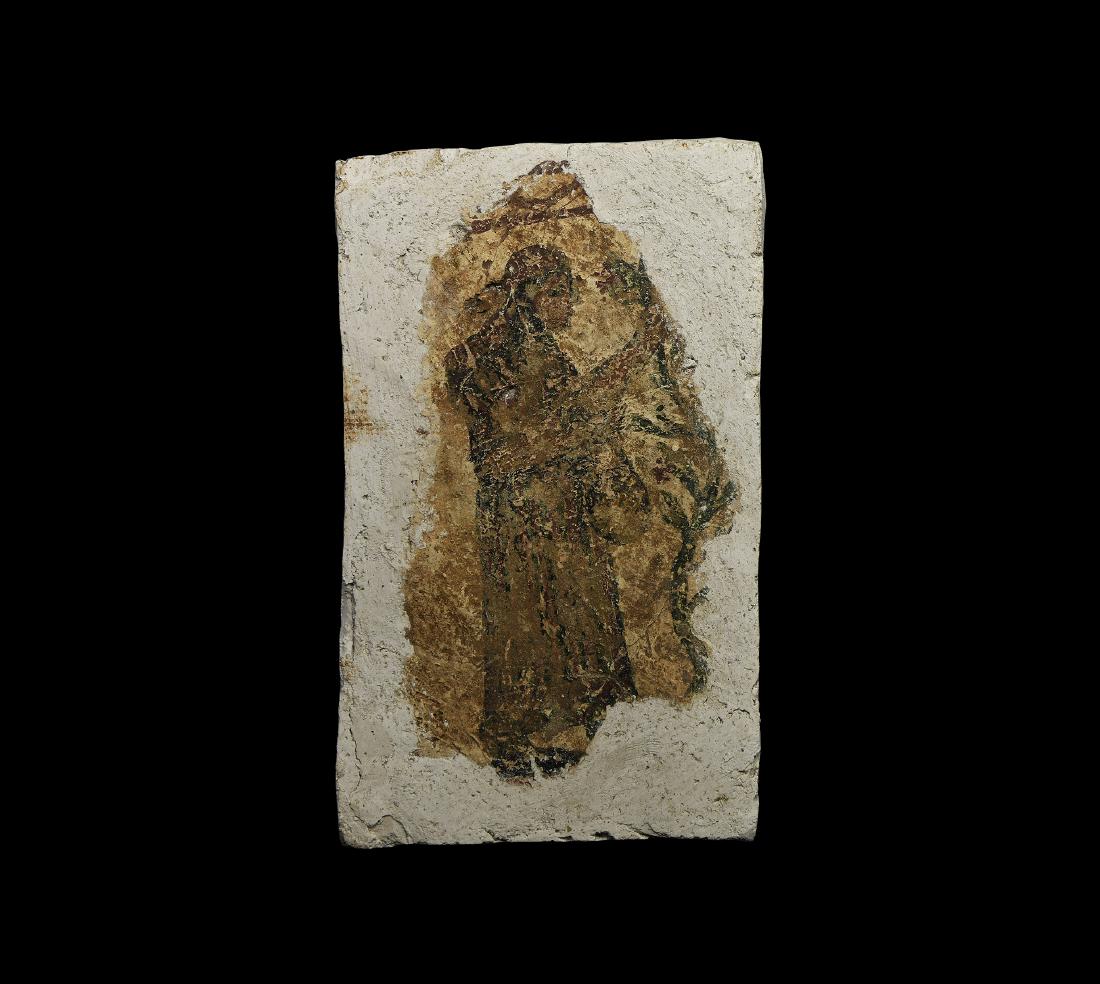 Roman Fresco of a Lady Picking Fruit: 4th-5th century AD. A fragment of painted plaster fresco with robed female and vine in shades of red and olive green; set in a modern plaster matrix; probably Eastern Empire. 3.5 kg, 28cm including ma