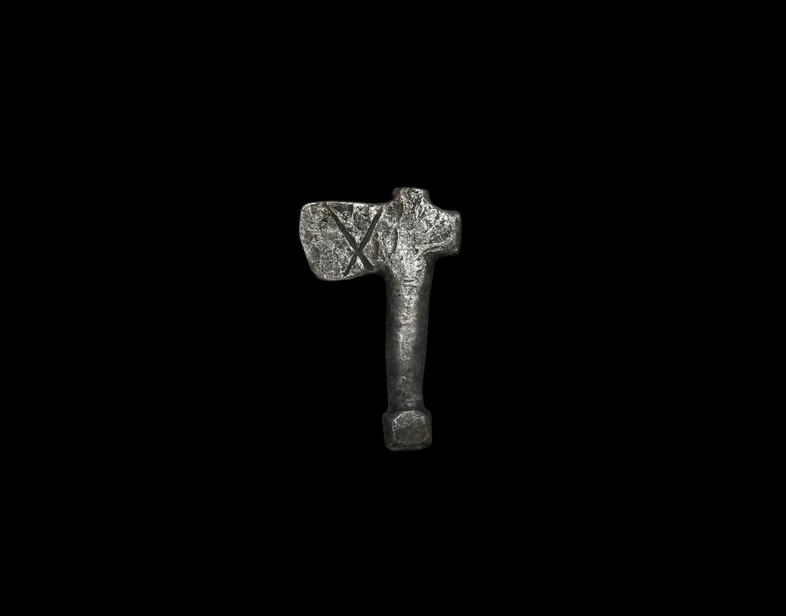 Roman Silver Votive Military Axe: 1st-2nd century AD. A silver model dolabrum military axe with incised saltire to each face. 5.70 grams, 29mm (1"). From a private UK collector; previously the property of an East Anglian collector; ac