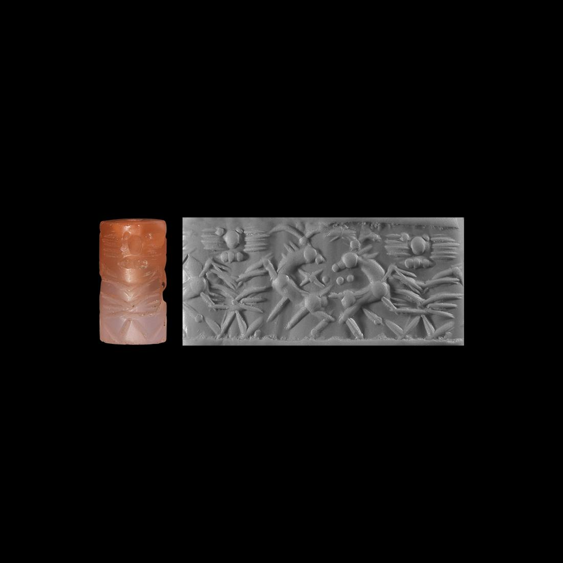 Western Asiatic Neo-Assyrian Cylinder Seal with: 9th-6th century BC. A carnelian cylinder seal with two caprides jumping forward, turning their heads backwards over their shoulders towards each other, form the centre of the image; between them a fou