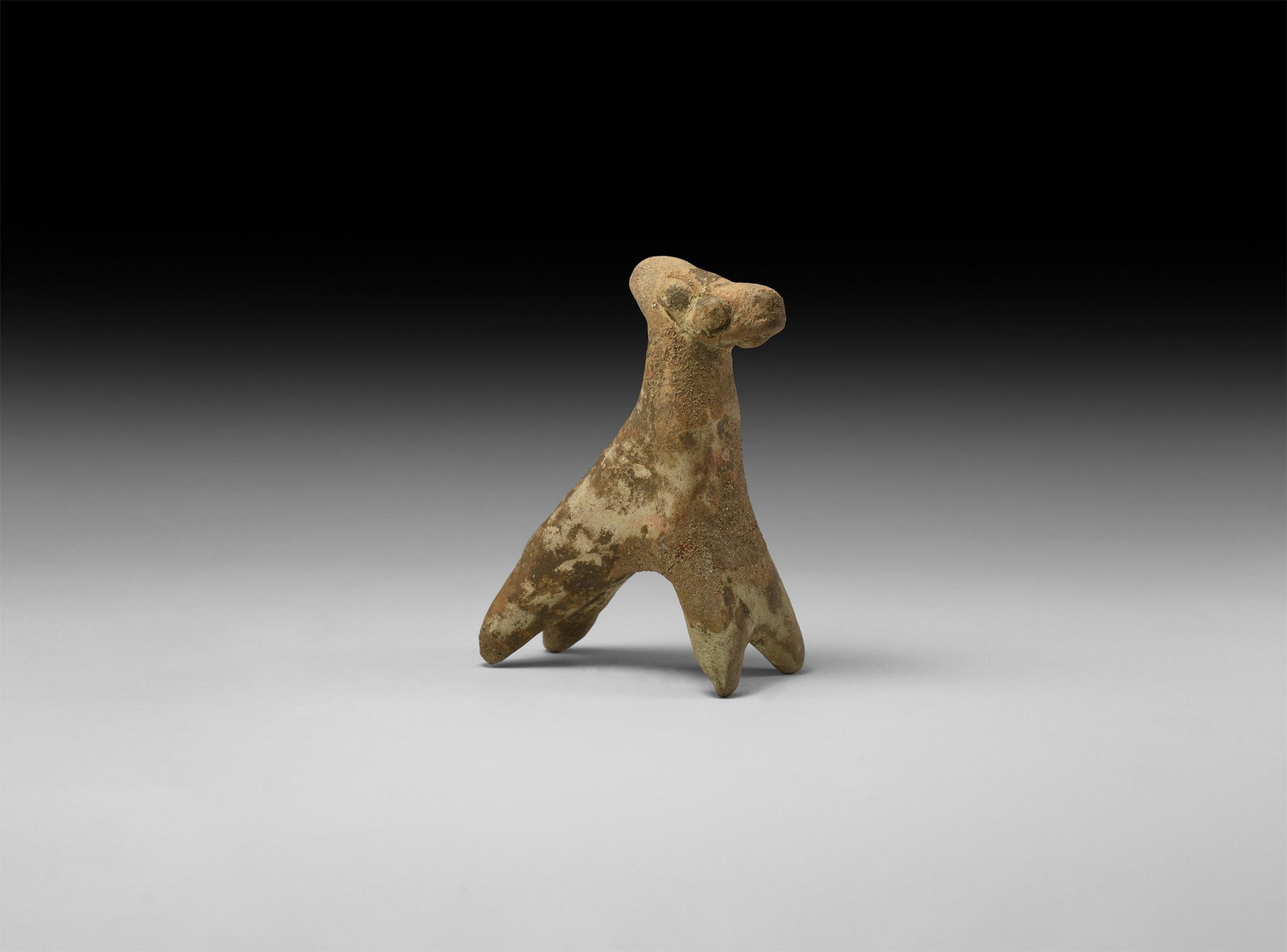 Parthian Terracotta Horse Figure: 3rd-1st century BC. A terracotta figure of a galloping horse with applied eyes and bridle details. 71.9 grams, 85mm (3 1/2"). From a private Netherlands collection; previously in an old collection sin