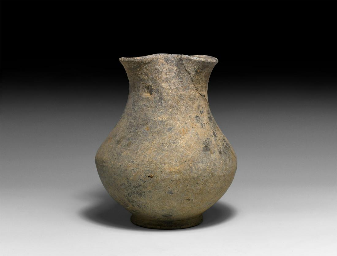 Roman Trefoil Jug: 1st-2nd century AD. A fragmentary ceramic pitcher with globular body and basal ring, strap handle and trefoil mouth. 430 grams, 16.2cm (6 1/4"). From a private collection; previously in an old central