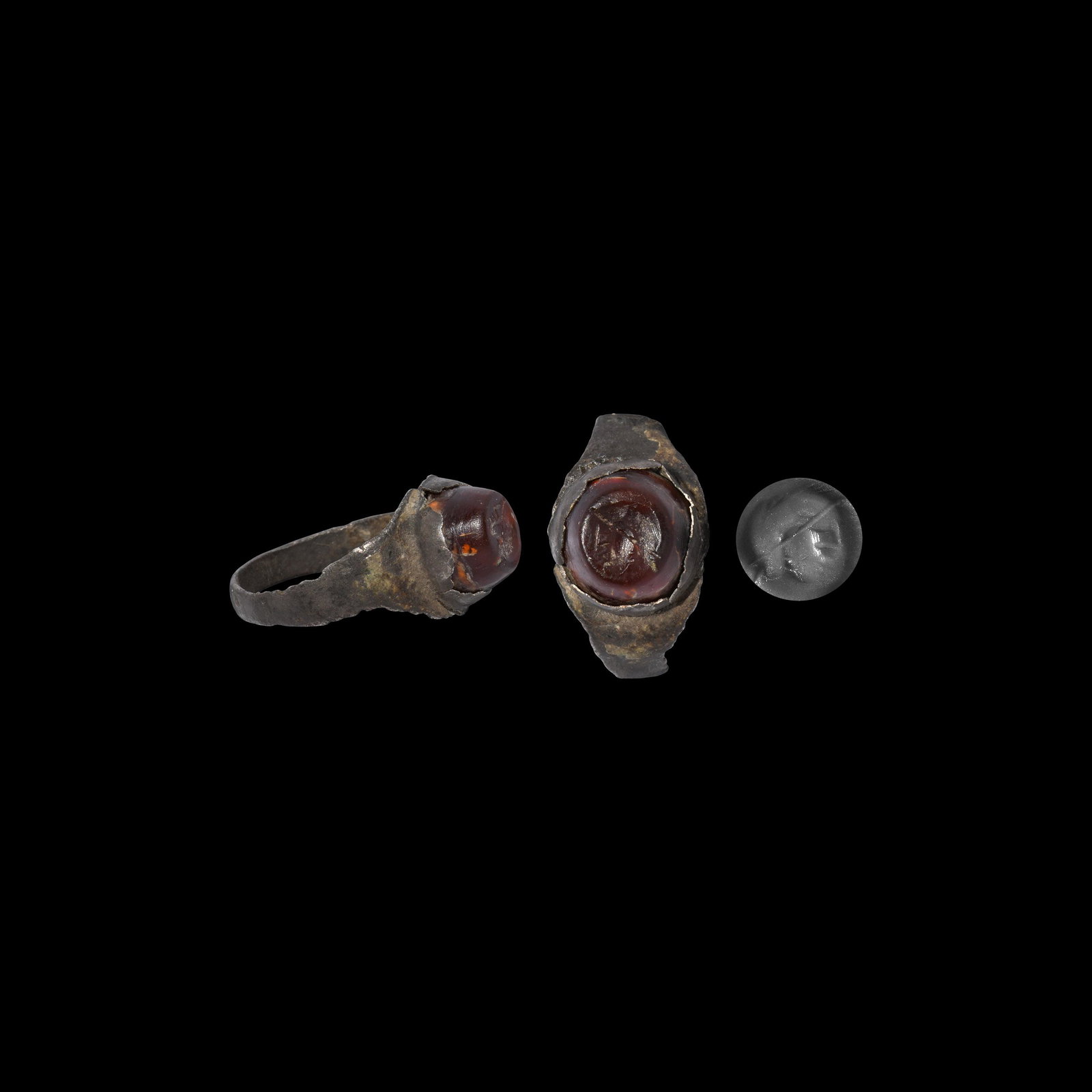 Roman Silver Ring with Bust Gemstone: 2nd-3rd century AD. A silver finger ring with circular cell to the bezel, inset agate gemstone with intaglio profile bust. Cf. Ruseva-Slokoska, L. Roman Jewellery, Sofia, 1991, item 191 for type. 2.34
