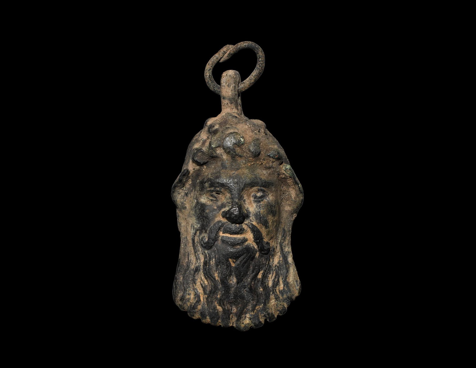 Large Roman Silenus Pendant: 2nd-3rd century AD. A bronze mask of Silenus with fleshy features and long beard, suspension loop and ring, hollow to the reverse. 160 grams, 11cm (4 1/4"). Ex an important Dutch collection; acquired 