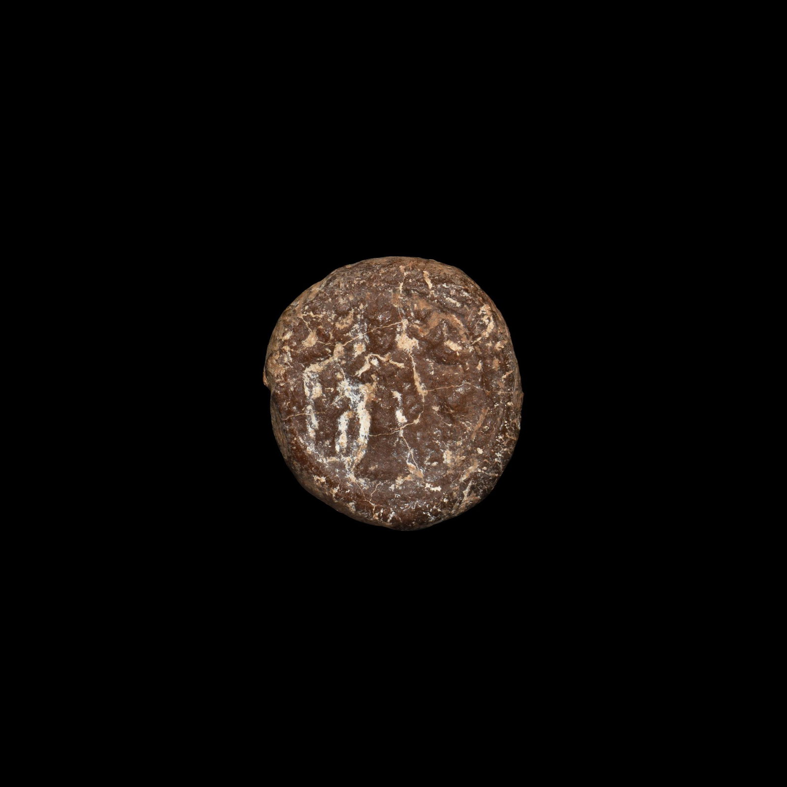 Roman Figural Glass Token: 1st-3rd century AD. A domed glass token or seal with two standing figures, an amphora to one side. 5.87 grams, 22mm (1"). From an important central London collection formed since the mid 1960s; thence