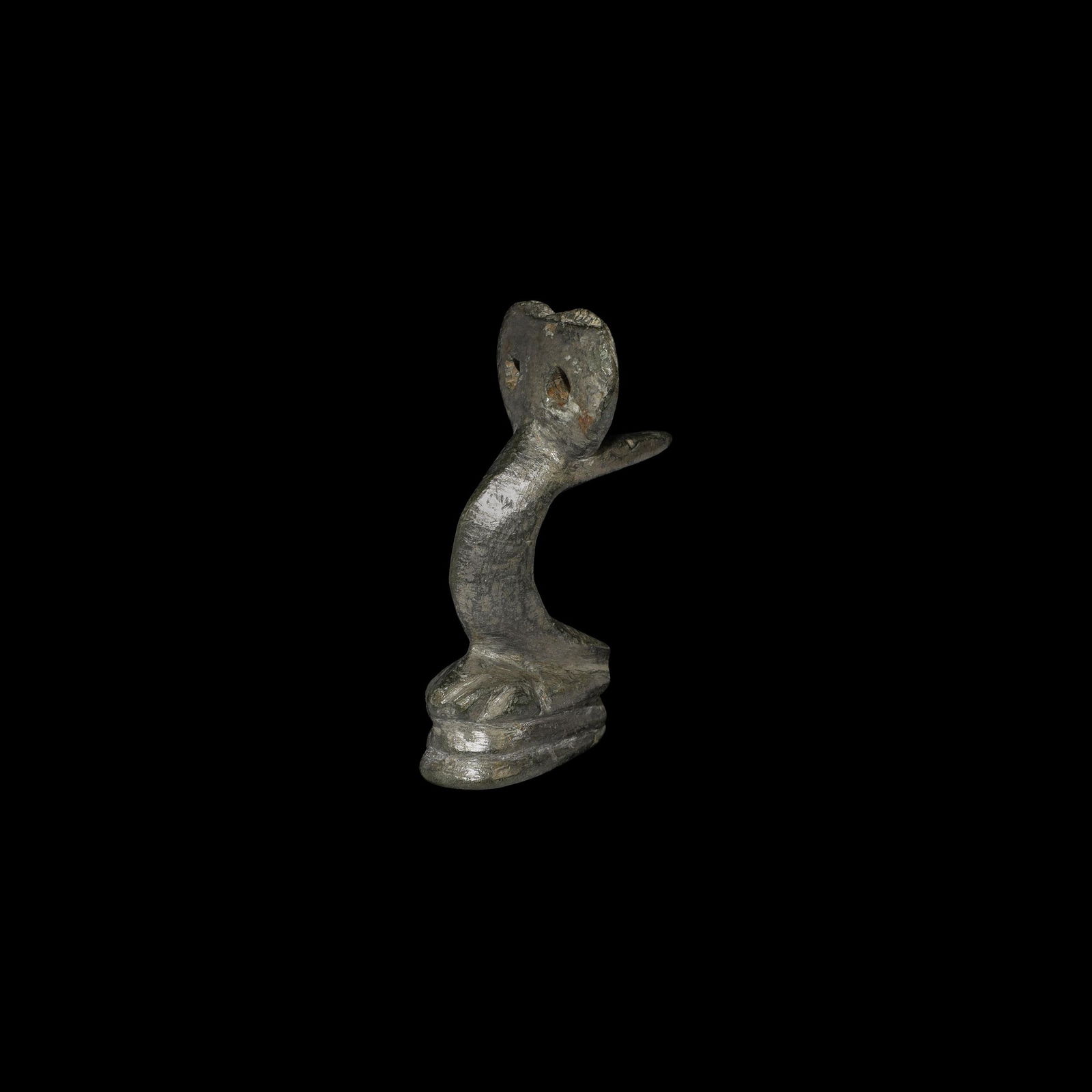 Roman Lion's Paw Fitting: 2nd-3rd century AD. A tinned bronze furniture fitting in the shape of a lion's paw, resting upon a doubled base; a double-loop above with fixing spur to the rear. 180 grams, 80mm (3"). From a home cou