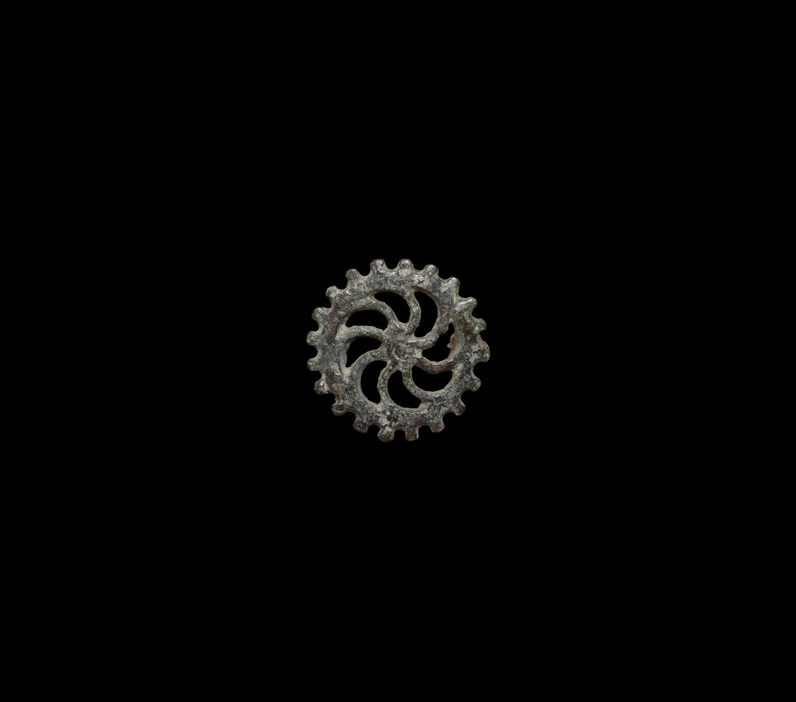 Roman Sun Whorl Brooch: 2nd century AD. A bronze discoid plate brooch with dentilled rim and eight curved radiating spokes, hinged pin and catch to the reverse. Cf. Hattatt, R. Ancient Brooches and Other Artefacts, Oxford, 1