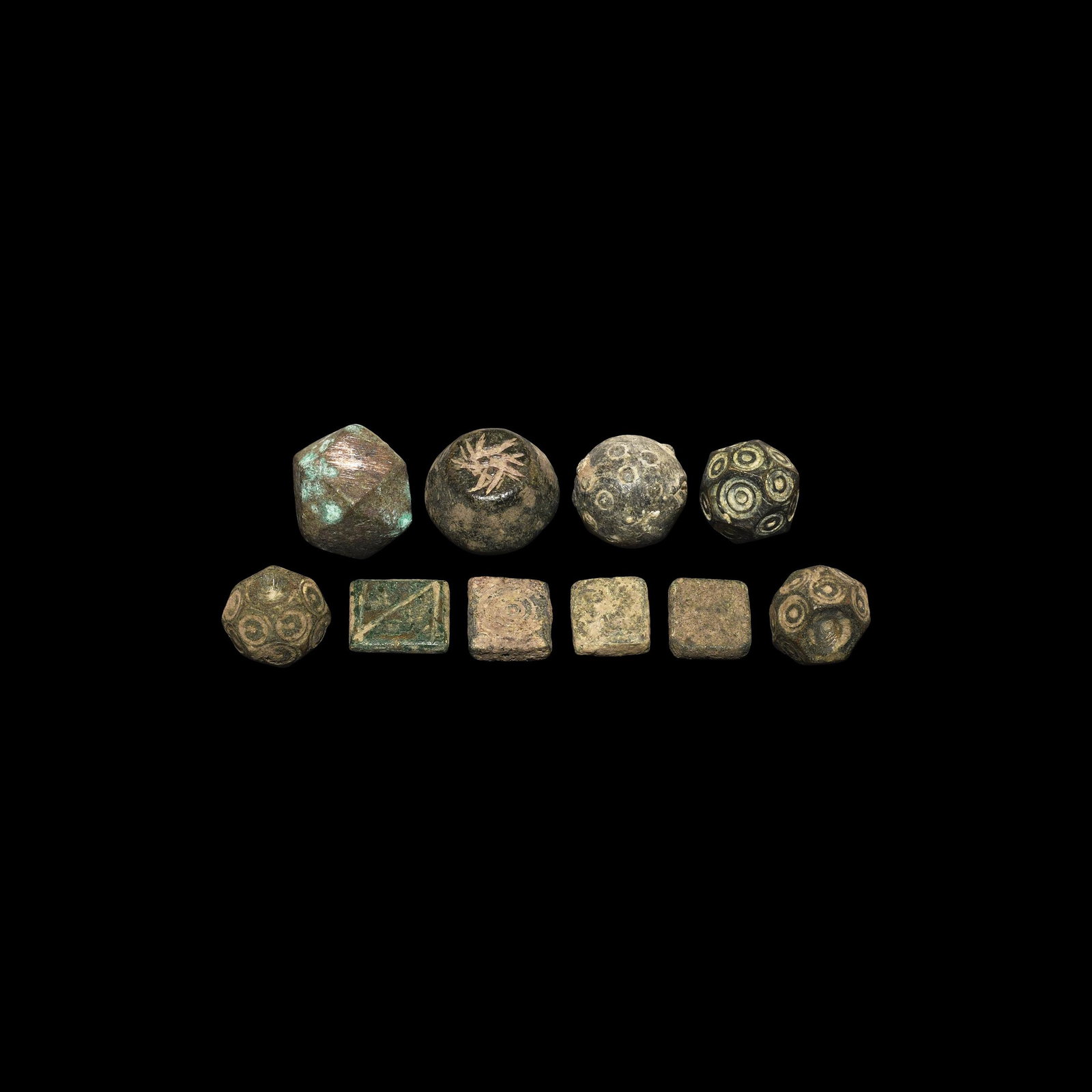 Byzantine Weight Collection: 10th-12th century AD. A mixed group of Byzantine and Arab-Byzantine bronze trade weights including polyhedral, tabular and biconvex types. 154 grams total, 12-20mm (1/2 - 3/4"). Property of a Dutch ge