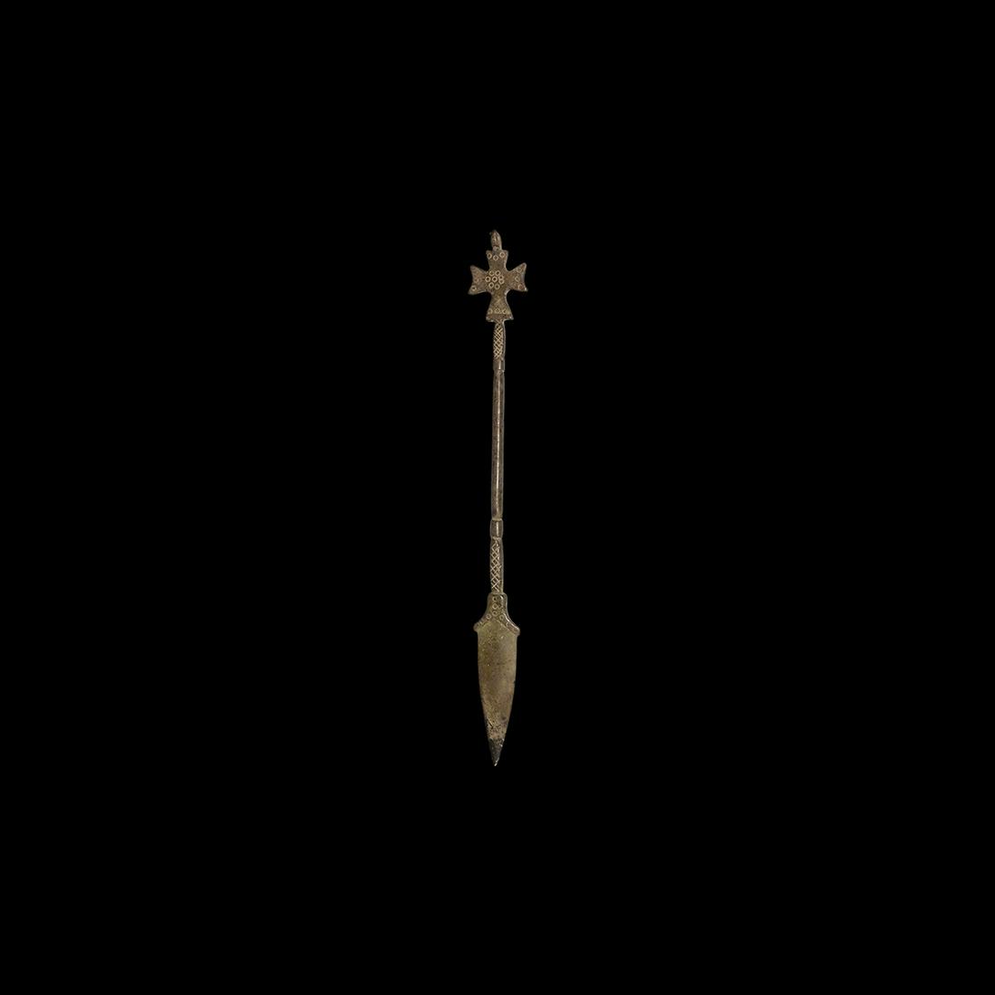 Byzantine Silver Implement with Cross: 5th-7th century AD. A heavily patinated silver leaf-shaped blade with hatched and balustered handle, the finial an equal-armed cross with punched annulets, loop above. 35 grams, 19cm (7 1/2"). Propert