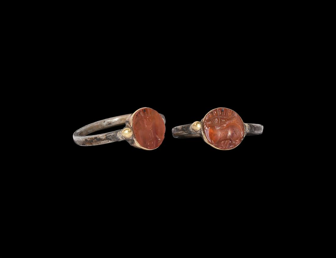 Sassanian Silver Ring with Stag Gemstone: 3rd-7th century AD. A silver finger ring with round-section hoop supporting a discoid cell, inset cloison with a carnelian intaglio of a stag; supplied with a museum-quality impression. 3.12 grams, 23