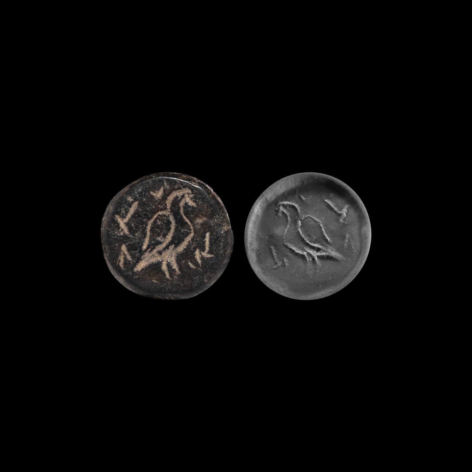 Stamp Seal with Bird: Later 1st millennium BC. A serpentine discoid stamp seal with integral loop to the reverse, intaglio bird motif with legend(?); accompanied by a museum-quality impression. 3.94 grams, 20mm (3/4"). Pro