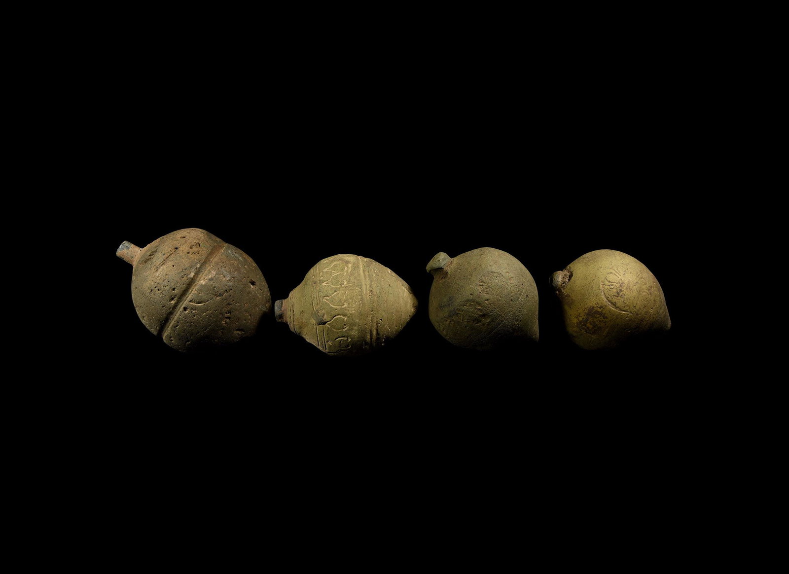 Byzantine 'Greek Fire' Fire Bomb or Hand Grenade Group: 9th-11th century AD. A group of hollow ceramic vessels each with conical body, intended to be filled with explosive liquid and a wick, and used as a hand grenade; two plain bulbous types, one with a b