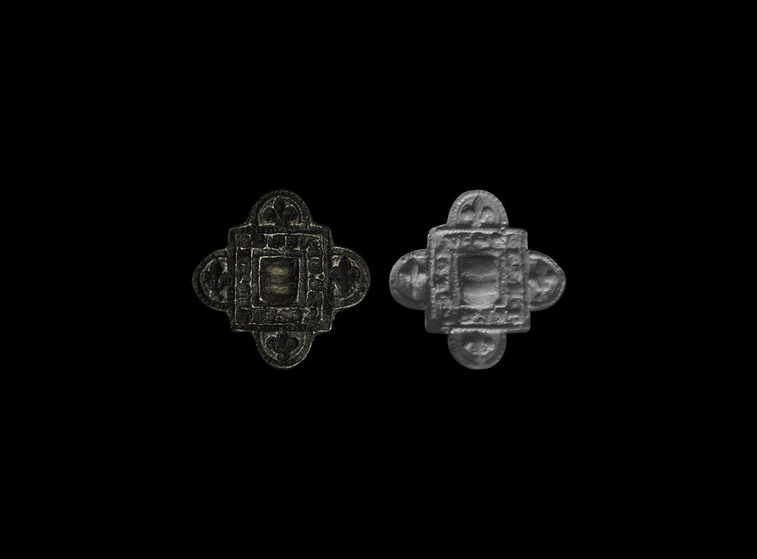 Medieval Heraldic Seal Matrix: 14th century AD. A bronze seal matrix formed as a square panel with D-shaped lobe to each edge, pierced lug handle to the reverse; intaglio beaded border with fleur-de-lys to each quadrant, inscribed 