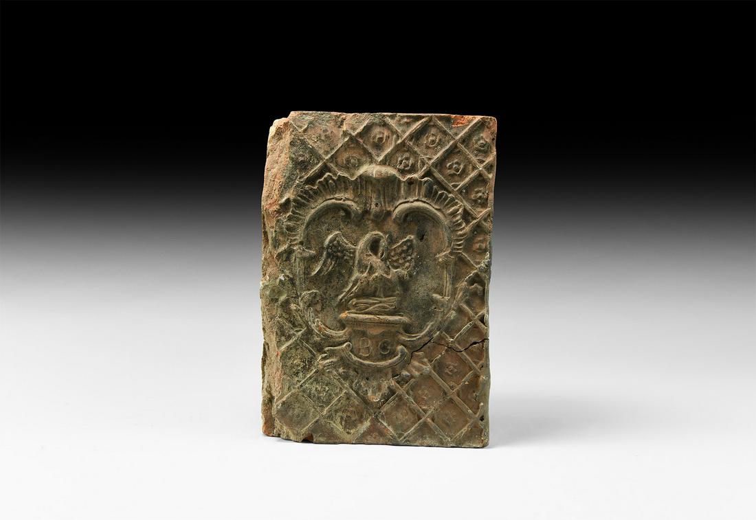 Large Post Medieval Fire Brick with Pelican: 17th-18th century AD. A rectangular ceramic brick with moulded lattice design, central panel with low-relief 'pelican in her piety' symbol above initials 'BC'. 3.5 kg, 22.5cm (9"). Property of a Suffo