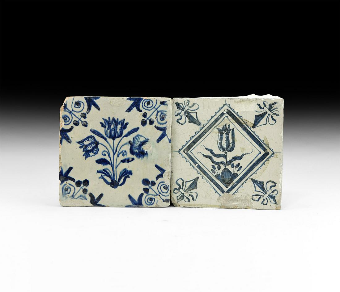Post Medieval Dutch Tulip Tile Pair: 17th century AD. A pair of glazed ceramic floor tiles comprising: one with fleur-de-lys to each corner, lozenge frame and single tulip; one with scrolls to each corner, central tulip with three flower