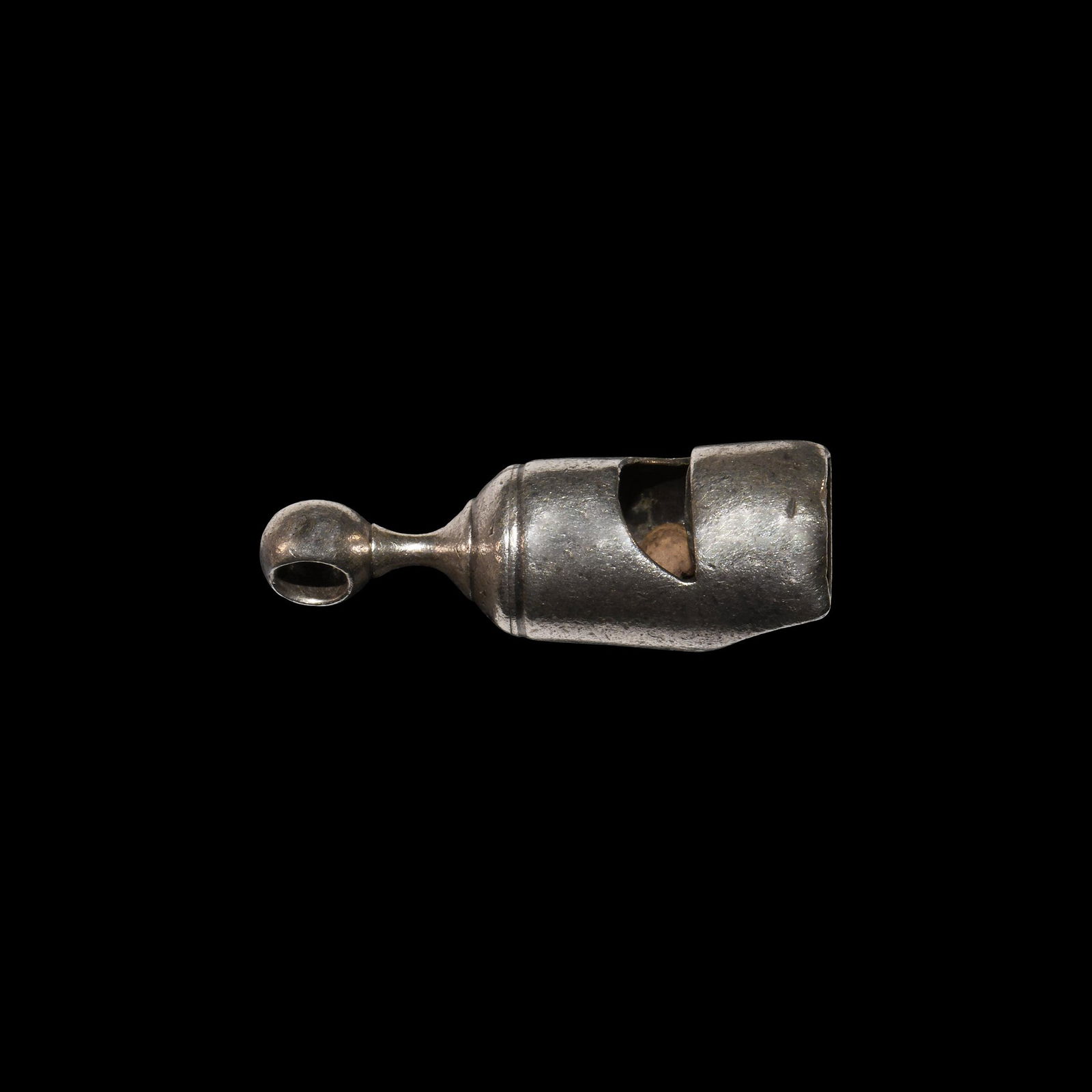 Victorian Silver Hawking Whistle: Hallmarked 1868(?) AD. A silver hawking whistle with loop finial, London hallmarks (date letter partly worn), two additional lion passant stamps on shoulder and scooped mouthpiece, stamped for retaile