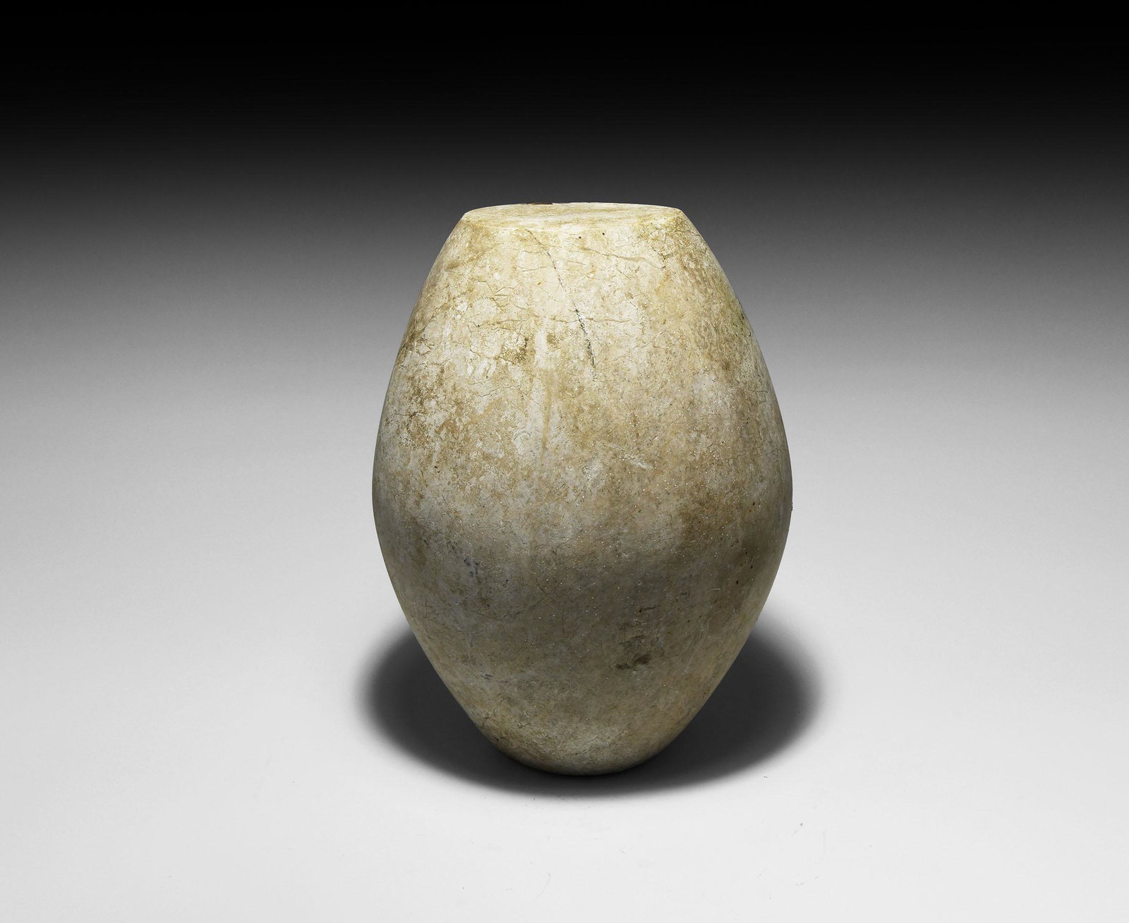 Western Asiatic Bactrian Alabaster Idol: 2nd millennium BC. A piriform limestone idol with two flat ends. 11 kg, 23cm (9"). From a private UK collection; previously with Pars Antiques, London W1; formerly in the Terence Eva collection 1980s-