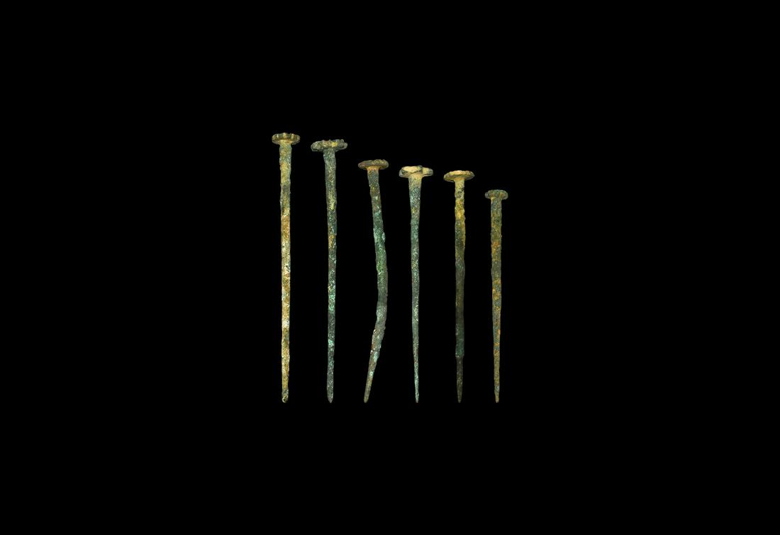 Western Asiatic Seal-Topped Pin Group: 3rd-2nd millennium BC. A mixed group of bronze dress pins, each with a rosette finial, two with old collector's labels attached; including two accompanied by typed and signed notes by W.G. Lambert, la