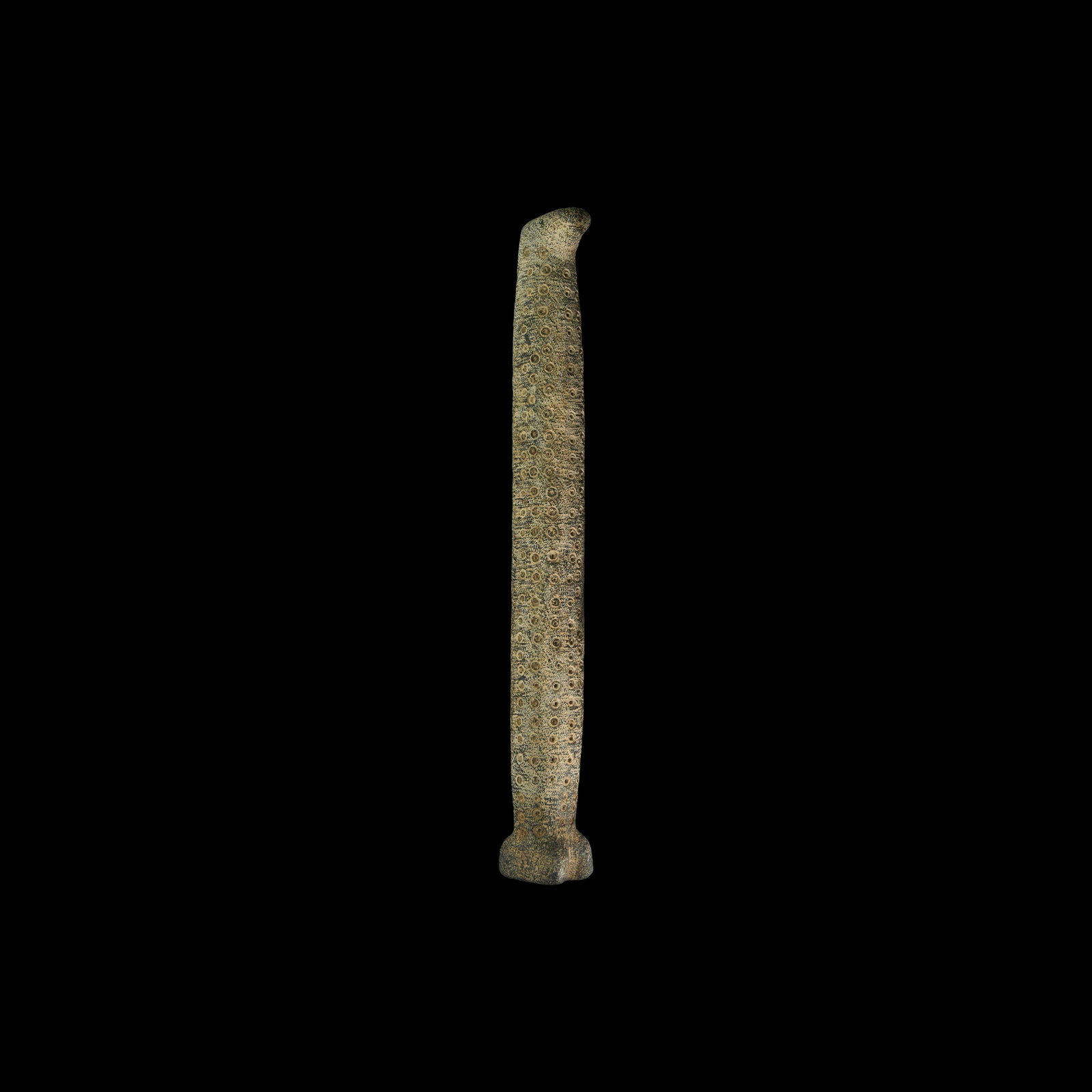 Western Asiatic Bactrian Sceptre Idol: 2nd millennium BC. A carved stone idol with round-section shaft, square base with cleft to the forward edge, elliptical spur to the upper end. 1.6 kg, 39.5cm (15 1/2"). Property of a West London gentl